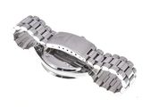 a close up of a watch on a white surface