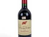a bottle of wine that is sitting on a table