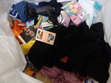 a pile of clothes and other items in a bag