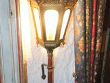 a lamp that is on the wall next to a door