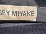 a close up of a label on a shirt that says isey miyake