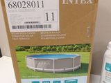 an image of a box of intex pool cleaner next to a bottle of water