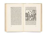 an open book with a drawing of a man on a horse
