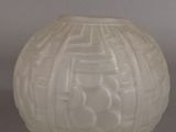 a white vase that is sitting on a table