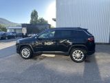 a black jeep is parked in front of a building