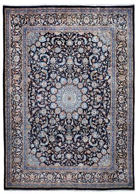a black and blue rug with a medallion design