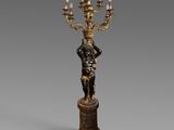 une image représentant une statue d'un homme tenant un lustre