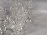 a lot of glasses that are sitting on a table