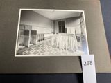black and white photograph of a kitchen with a long counter