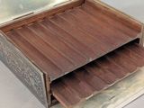 an open box with a drawer inside of it on a table