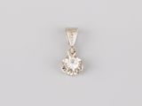 a white gold pendant with a round brilliant cut diamond