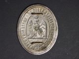 a silver coin with a picture of a man on a horse on it