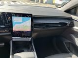 the dashboard of a car with a gps device in the center