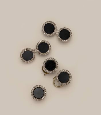 three pairs of black and white diamond earrings and a pair of black and white diamond earrings