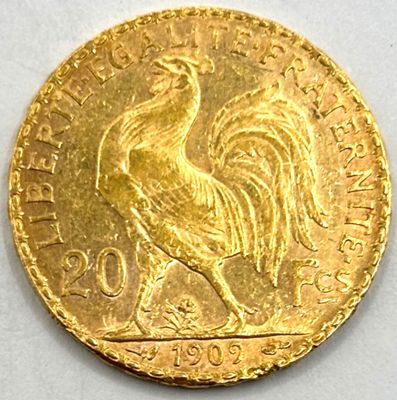 an image of a gold coin with a rooster on it