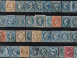 a group of stamps with different designs on them on a black surface