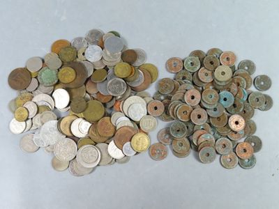 two piles of coins sitting next to each other on a table