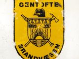an image of a yellow and black sign on a white wall