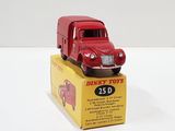 a red toy truck sitting on top of a yellow box