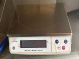 a digital scale sitting on top of a counter