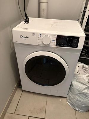 a washer and dryer in a small room