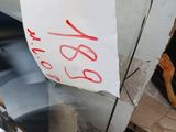 a piece of glass with a sign on it sitting on a table