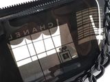 a chanel purse with a chain around it
