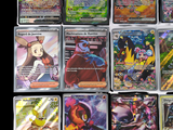 a lot of pokemon cards that are on the table