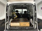 a white van with a table in the back of it