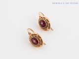 a pair of ruby and diamond earrings