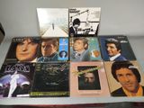 a lot of music cds on a table