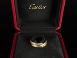 a close up of a ring in a red box on a black surface
