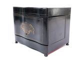 a black box with a gold design on it