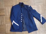 navy blue jacket with white trims and buttons on a wooden floor