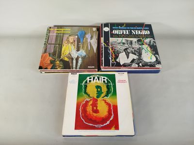 three books sitting on top of a white table next to each other