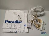 a pair of shoes and a t - shirt sitting on a table