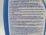 a close up of a bottle of blue liquid on a white surface