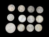 six different types of silver coins on a black background