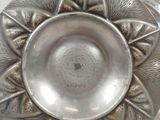 a silver plate that is sitting on a table