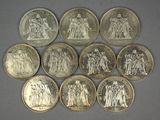 a close up of a bunch of coins on a table