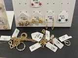 lot of gold and silver jewelry including a necklace, bracelet, and earring
