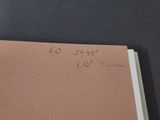 a piece of brown paper with writing on it