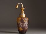 an image of a brown and gold vase with a faucet