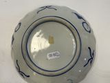 a blue and white bowl on a white table