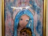 a painting of a woman holding a baby in a gold frame
