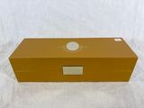 a brown box with a white label on it sitting on a white surface