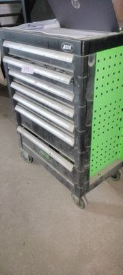 a laptop computer sitting on top of a metal cart