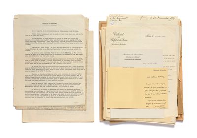 an old document with a lot of papers sitting on top of it