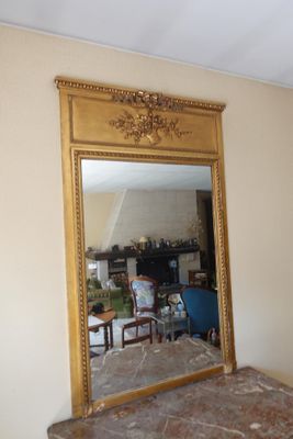 a mirror that is sitting on a table in a room