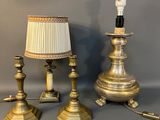 two lamps and a lamp shade are sitting on a table